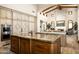Gourmet kitchen features granite island, custom cabinetry, and high-end appliances at 20567 N 112Th St, Scottsdale, AZ 85255