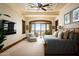 Main bedroom with private balcony, mountain views, and a large TV at 20567 N 112Th St, Scottsdale, AZ 85255