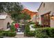 Landscaped patio with seating area and fireplace at 20567 N 112Th St, Scottsdale, AZ 85255