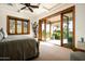 Spacious bedroom with private patio access and mountain views at 20567 N 112Th St, Scottsdale, AZ 85255
