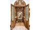 Custom wine cellar with ample storage and ornate wood doors at 20567 N 112Th St, Scottsdale, AZ 85255