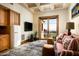 Cozy recreation room with a sofa, fireplace, and mountain views at 20567 N 112Th St, Scottsdale, AZ 85255