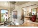 Stunning hallway with a large chandelier and scenic views at 20567 N 112Th St, Scottsdale, AZ 85255