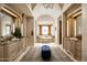 Elegant Primary bathroom with double vanities, a soaking tub, and stained glass window at 20567 N 112Th St, Scottsdale, AZ 85255