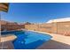 Inviting backyard oasis featuring a sparkling blue pool at 7752 W Mary Jane Ln, Peoria, AZ 85382
