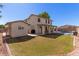 Spacious backyard with a pool, shed, and grassy area at 7752 W Mary Jane Ln, Peoria, AZ 85382