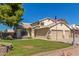 Two story house with double garage and manicured lawn at 7752 W Mary Jane Ln, Peoria, AZ 85382