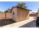 Tan colored storage shed in backyard at 7752 W Mary Jane Ln, Peoria, AZ 85382