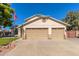 Two-car garage and well-maintained front yard at 7752 W Mary Jane Ln, Peoria, AZ 85382