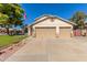 Two-story house with three-car garage and landscaped yard at 7752 W Mary Jane Ln, Peoria, AZ 85382