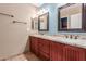Bathroom boasts a double vanity with granite countertops at 7752 W Mary Jane Ln, Peoria, AZ 85382