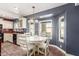 Kitchen nook with a white table and chairs, perfect for casual dining at 7752 W Mary Jane Ln, Peoria, AZ 85382