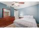 Bright bedroom with a double bed and wooden dresser at 7752 W Mary Jane Ln, Peoria, AZ 85382