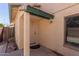 Side entrance with door and small window at 7752 W Mary Jane Ln, Peoria, AZ 85382