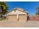 Two car garage with tan colored doors at 7752 W Mary Jane Ln, Peoria, AZ 85382