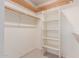 Large walk-in closet with shelving and hanging rods at 7752 W Mary Jane Ln, Peoria, AZ 85382