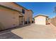 Side yard with concrete patio and AC units at 7752 W Mary Jane Ln, Peoria, AZ 85382