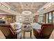 Open living room with high ceilings, white sofas and a large chandelier at 9719 E Madera Dr, Scottsdale, AZ 85262