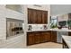 Kitchen detail featuring a built-in oven and dark wood cabinets at 9719 E Madera Dr, Scottsdale, AZ 85262
