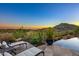 Stunning desert landscape views from expansive patio with pool and lounge area at 9719 E Madera Dr, Scottsdale, AZ 85262
