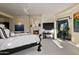 Bright main bedroom with fireplace, large windows, and access to patio at 9719 E Madera Dr, Scottsdale, AZ 85262