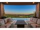 Covered patio boasts stunning sunset views and comfortable seating at 9719 E Madera Dr, Scottsdale, AZ 85262