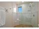 Large walk-in shower with glass enclosure and a built-in seat at 9719 E Madera Dr, Scottsdale, AZ 85262