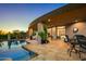 Covered patio with seating, fire pit, and access to pool at 9719 E Madera Dr, Scottsdale, AZ 85262