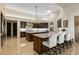 Gourmet kitchen boasting double islands, stainless steel appliances, and a brick oven at 9719 E Madera Dr, Scottsdale, AZ 85262
