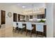 Spacious kitchen with an island, stainless steel appliances, and a breakfast bar at 9719 E Madera Dr, Scottsdale, AZ 85262