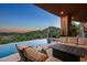 Relaxing patio with fire pit and infinity pool overlooking scenic views at 9719 E Madera Dr, Scottsdale, AZ 85262