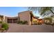 Modern home with brick exterior and a curved driveway at 9719 E Madera Dr, Scottsdale, AZ 85262