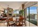 Casual dining area with a round table and chairs near a fireplace at 9719 E Madera Dr, Scottsdale, AZ 85262