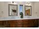 Double vanity bathroom with marble countertops and large mirrors at 9719 E Madera Dr, Scottsdale, AZ 85262