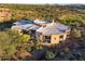 Modern home with a unique circular roofline and desert landscape at 9719 E Madera Dr, Scottsdale, AZ 85262