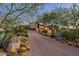Luxury home with a long driveway and desert landscaping at 9719 E Madera Dr, Scottsdale, AZ 85262