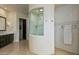 Bathroom with walk-in shower and tiled walls at 9719 E Madera Dr, Scottsdale, AZ 85262