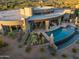 Circular home showcasing a large pool and patio area at 9719 E Madera Dr, Scottsdale, AZ 85262