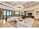 Living area with high ceilings, large chandelier, and comfortable seating at 9719 E Madera Dr, Scottsdale, AZ 85262