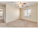 Bright bedroom featuring a window with blinds and ceiling fan at 15417 N 160Th Dr, Surprise, AZ 85374