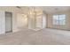 Living room with closet and view to entryway at 15417 N 160Th Dr, Surprise, AZ 85374