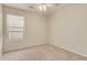 Bedroom with window, ceiling fan, and carpet at 15417 N 160Th Dr, Surprise, AZ 85374