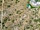 Aerial view of vacant land adjacent to a luxury home with a pool and solar panels at 0 E Red Bird Rd, Scottsdale, AZ 85262