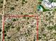 Aerial view of vacant land bordered in red, adjacent to an estate with a pool and solar panels at 0 E Red Bird Rd, Scottsdale, AZ 85262
