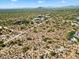 Aerial view of vacant land with surrounding desert landscape and distant mountain views at 0 E Red Bird Rd, Scottsdale, AZ 85262