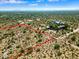 Aerial view highlighting a vacant lot with red boundary lines and neighboring properties at 0 E Red Bird Rd, Scottsdale, AZ 85262