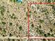 Aerial view showing a vacant lot with desert landscape, next to a luxury home with a pool at 0 E Red Bird Rd, Scottsdale, AZ 85262