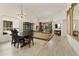 Bright dining room with chandelier and dark wood dining set at 23817 S Harmony Way, Sun Lakes, AZ 85248