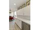 White kitchen with stainless steel appliances and ample counter space at 23817 S Harmony Way, Sun Lakes, AZ 85248