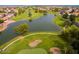 Aerial view showcasing a community pool and golf course at 23817 S Harmony Way, Sun Lakes, AZ 85248